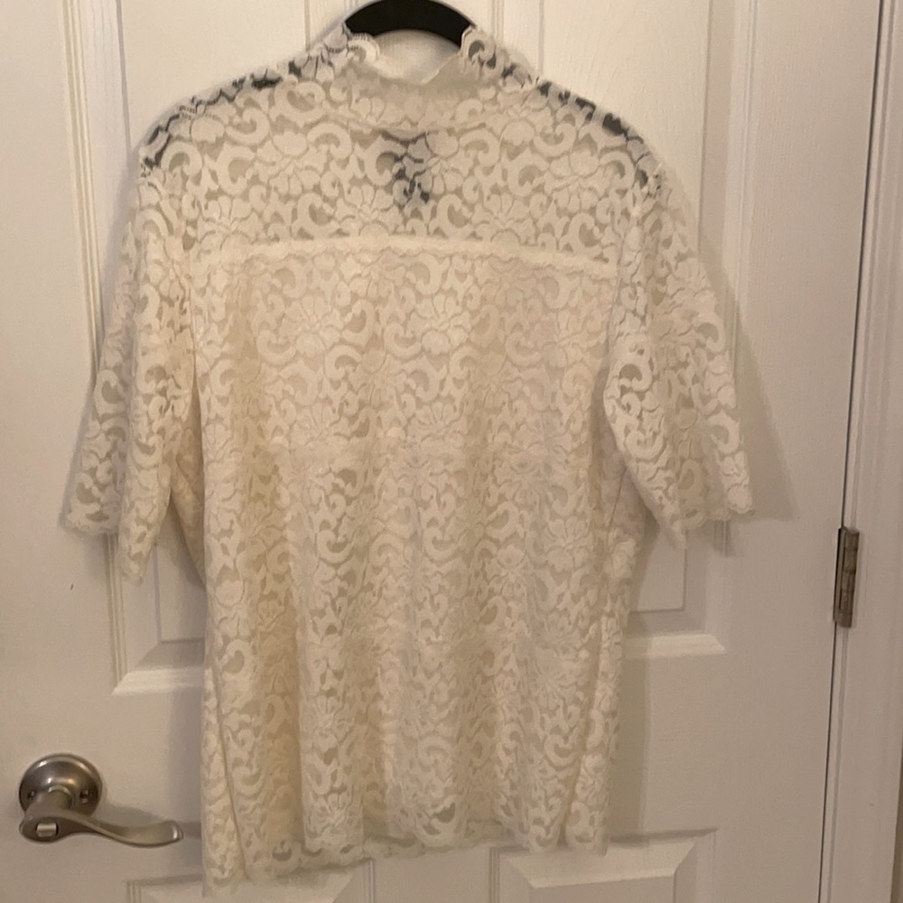 Ladies turtle neck short sleeved lace top.